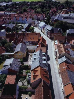 Denmark, Jutland, Ribe, View south-west over city rooftops and cobbled street from the twelth