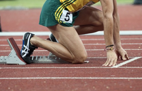 India, Delhi, 2010 Commonwealth games  Track event runner on his starting blocks.