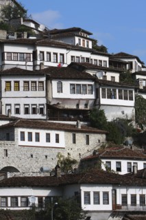 Albania, Berat, Ottoman houses in the old town with white painted exteriors and tiled roof tops