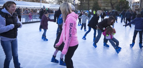 England, East Sussex, Brighton, Royal Pavilion Ice Rink  people skating.