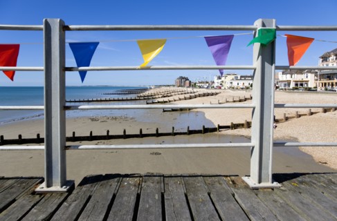 England, West Sussex, Bognor Regis, Wooden groynes at low tide used as sea defences against erosion