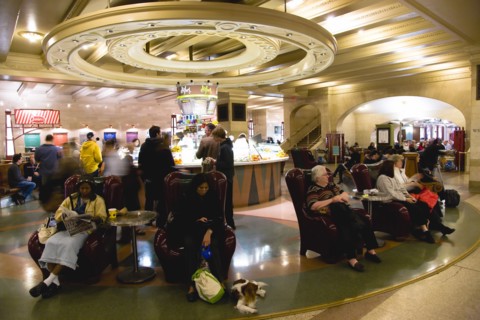 USA, New York, New York City, Manhattan  Grand Central Terminal Station Passengers sitting in