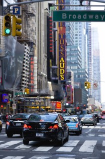 USA, New York, New York City, Manhattan  Cars crossing Broadway at green traffic lights travelling