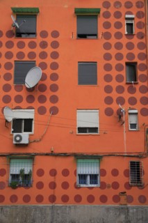 Albania, Tirane, Tirana, Detail of exterior facade of apartment block painted orange with pattern