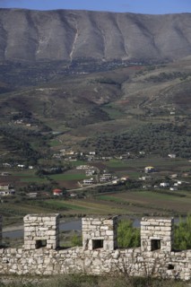 Albania, , Crenellated battlements of ancient castle with cannons with view across landscape beyond