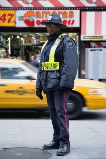 USA, New York, New York City, Manhattan  Times Square Public Safety Officer in uniform on patrol in