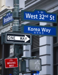 USA, New York, New York City, Manhattan  Street signs for West 32nd Street also known as Korea Way