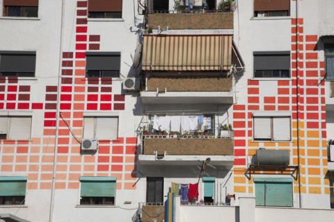 Albania, Tirane, Tirana, Detail of exterior facade of apartment block with pattern painted on walls