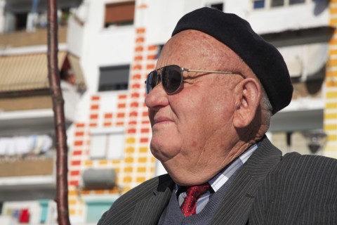 Albania, Tirane, Tirana, Head and shoulders portrait of an elderly man wearing sunglasses and a
