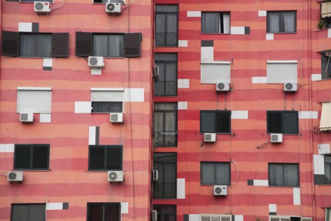 Albania, Tirane, Tirana, Part view of exterior facade of colourful apartment building with