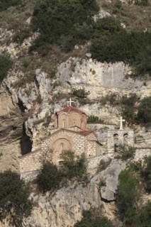 Albania, Berat, Church of St Michael under rock face.