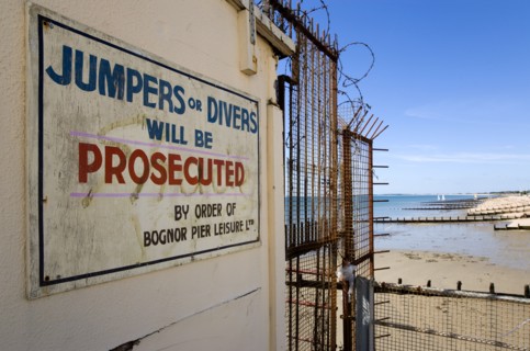 England, West Sussex, Bognor Regis, Warning sign against jumping or diving off the pier into the