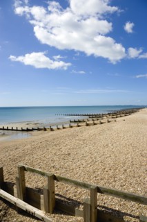 England, West Sussex, Bognor Regis, Wooden groynes at low tide used as sea defences against erosion
