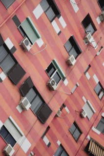 Albania, Tirane, Tirana, Angled part view of exterior facade of colourful apartment building with