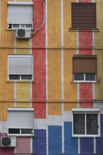Albania, Tirane, Tirana, Detail of exterior facade of striped  multi-coloured apartment block with