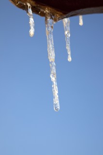 Weather, Winter, Ice, Icicles hanging from household facia panel.