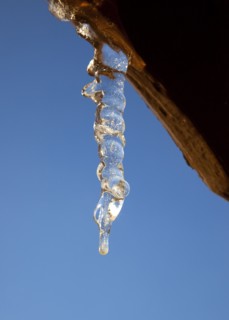 Weather, Winter, Ice, Icicles hanging from household facia panel.