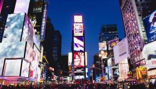 USA, New York, New York City, Manhattan  People walking at night in Times Square at the junction of