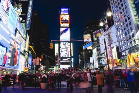 USA, New York, New York City, Manhattan  People walking at night in Times Square at the junction of