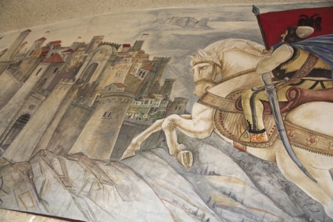 Albania, Kruja, Mural on the wall of the National Skanderbeg Museum depicting battle scene.