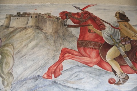 Albania, Kruja, Mural on the wall of the National Skanderbeg Museum depicting battle scene.