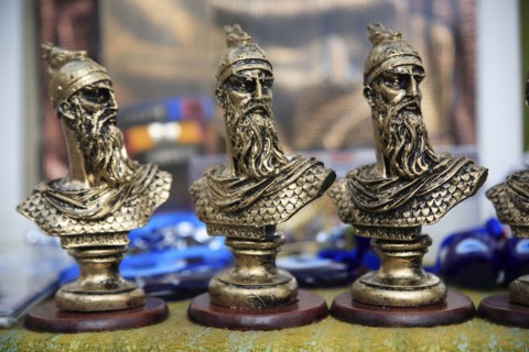 Albania, Kruja, Souvenirs displayed for sale on stalls in the market bazaar in the old town.