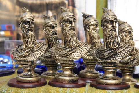 Albania, Kruja, Souvenirs displayed for sale on stalls in the market bazaar in the old town.