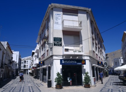 Portugal, Algarve, Faro, Main shopping area with white washed buildings and colourfully decorated