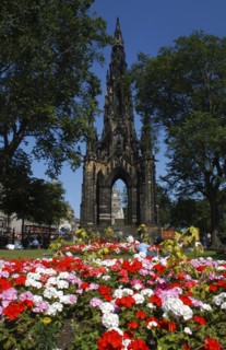 Scotland, Lothian, Edinburgh, Scott Monument in Princes Street with flower beds in the foreground