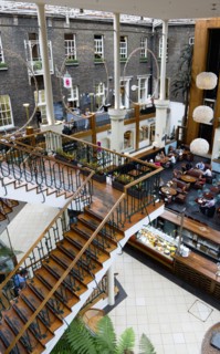 Ireland, County Dublin, Dublin City, Powerscourt Centre restaurants with people at tables beside