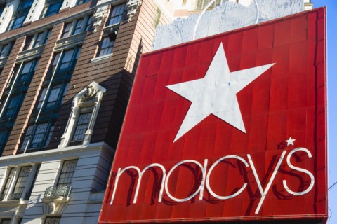 USA, New York, New York City, Manhattan  Red sign for Macys department store with cars on 34th