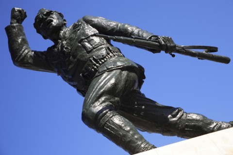 Albania, Tirane, Tirana, Statue of the Unknown Partisan  from low angle looking upwards  against