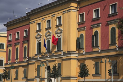 Albania, Tirane, Tirana, Pink and yellow exterior facades of government buildings on Skanderbeg