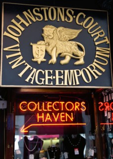 Ireland, County Dublin, Dublin City, Sign for Johnstons Court Vintage Emporium and red neon lights