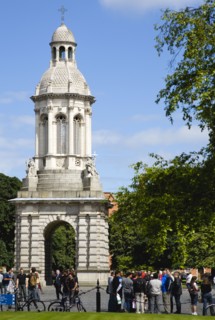 Ireland, County Dublin, Dublin City, Trinity College university with people walking through