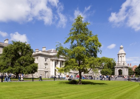 Ireland, County Dublin, Dublin City, Trinity College university with people walking through
