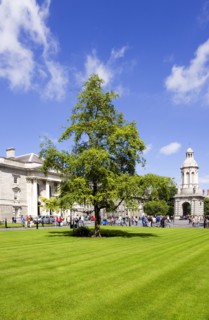 Ireland, County Dublin, Dublin City, Trinity College university with people walking through