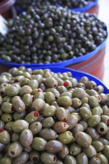 Albania, Tirane, Tirana, Display of black  and stuffed green olives for sale in Avni Rustemi Market
