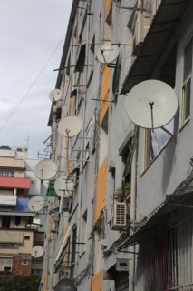 Albania, Tirane, Tirana, Satellite dishes on apartment building.