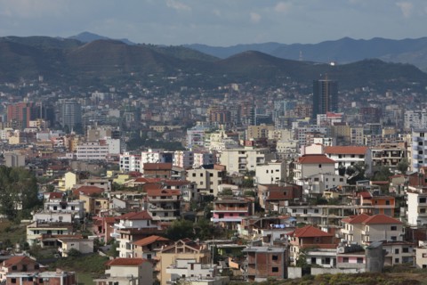 Albania, Tirane, Tirana, View across residential buildings to the hillside beyond.