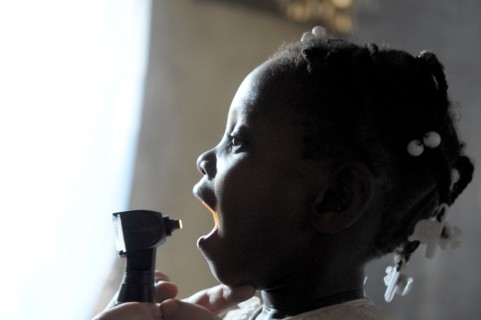 Haiti, La Gonave, Child being examined by medical staff provided by the Scottish Charity LemonAid