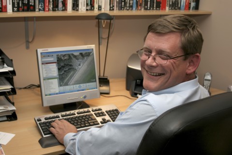 Media, Computer, Office, A man working from his home office  turning towards camera  sitting at