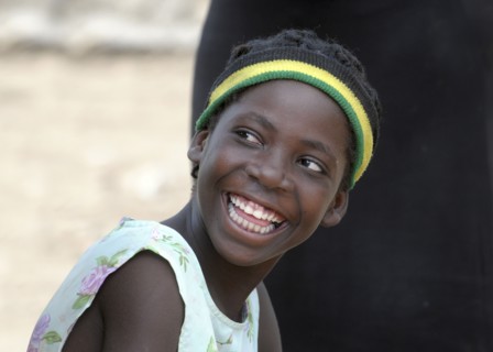 Haiti, La Gonave, Young happy smiling girl.