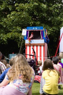 Children, Entertainment, Punch And Judy, Children sitting on grass watching the traditional puppet