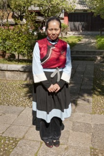 Young Naxi woman wearing traditional costume. Photo : Mel Longhurst