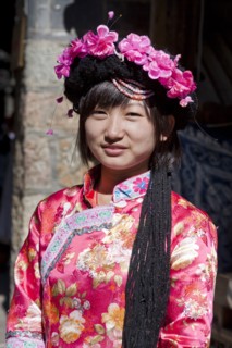 Mosuo girl wearing a colourful costume. Photo : Mel Longhurst
