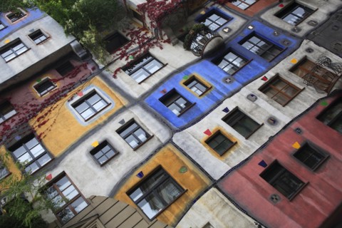 The Hundertwasser-Krawinahaus angled part view of exterior facade of apartment building. Photo :