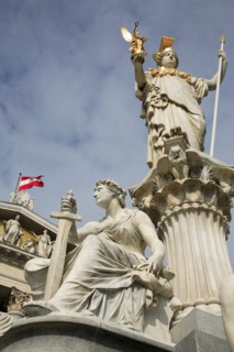 Statue of Athena raised on pillar above fountain in front of the Parliament building. Photo: