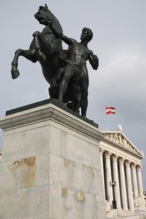 Bronze statue of a horse tamer a symbol for the suppression of passion by Joseph Lax in front of