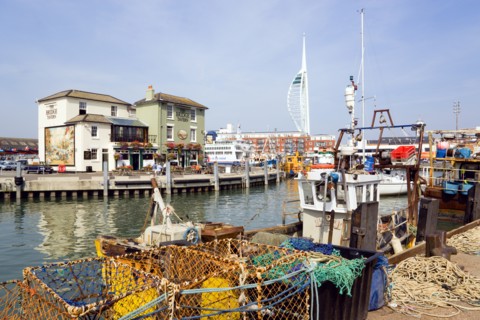 The Camber in Old Portsmouth showing the Spinnaker Tower behind the Bridge Tavern with its mural of